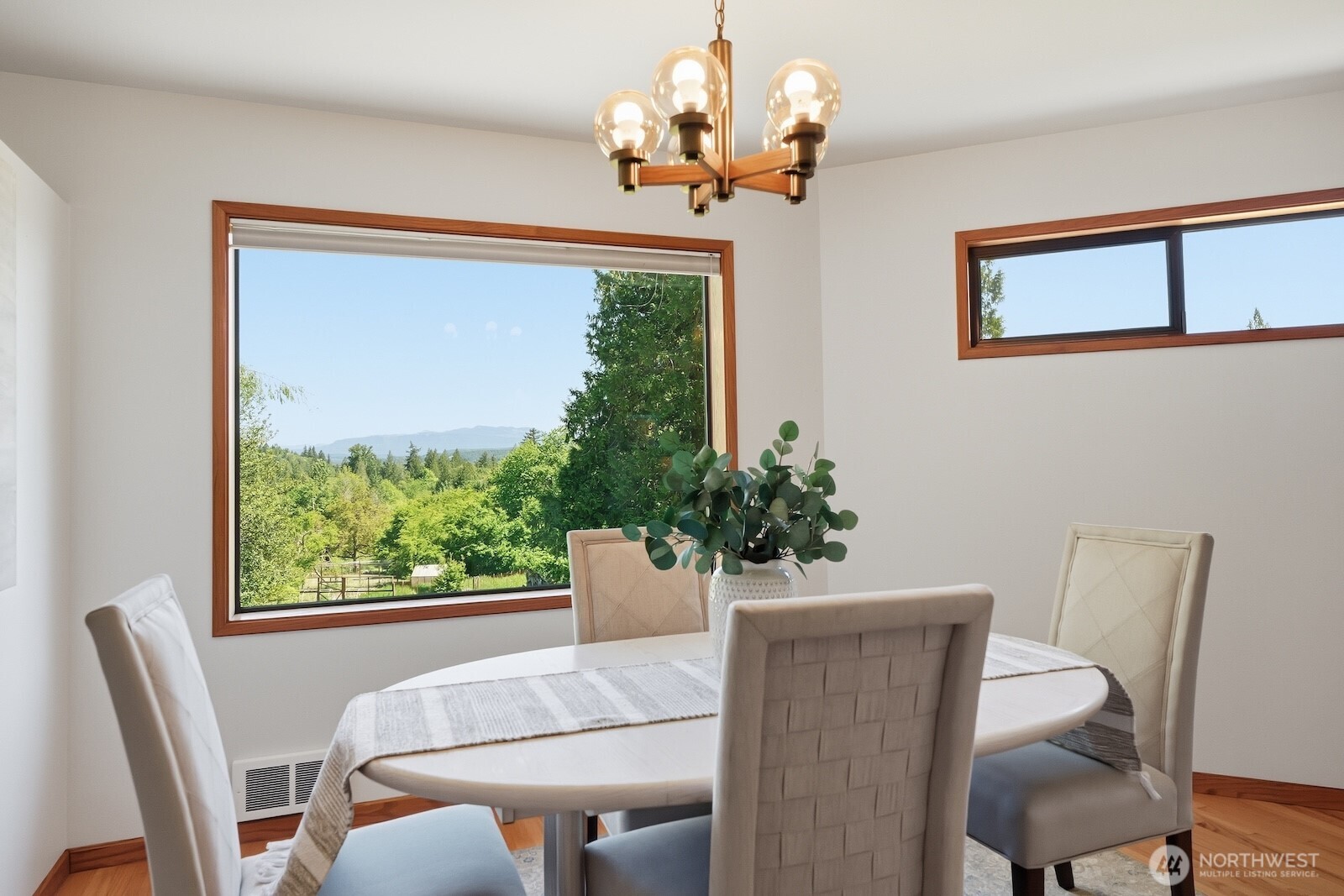 30130 Southeast Issaquah-Fall City Road Fall City, WA 98024 - Photo 12 of 39 a view of a dining room with furniture a potted plant and a chandelier