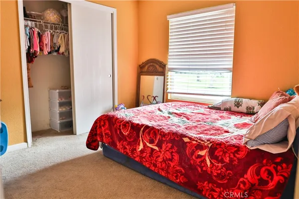 a view of a bedroom with window and bathroom
