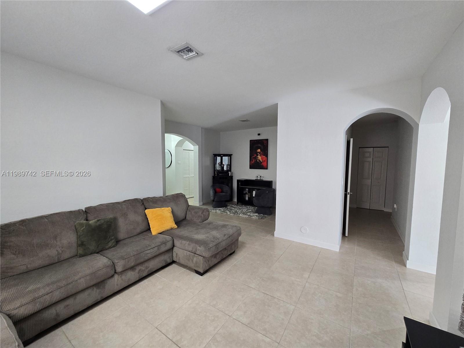 24164 Southwest 113th Path Homestead, FL 33032 - Photo 13 of 68 a living room with furniture and a couch