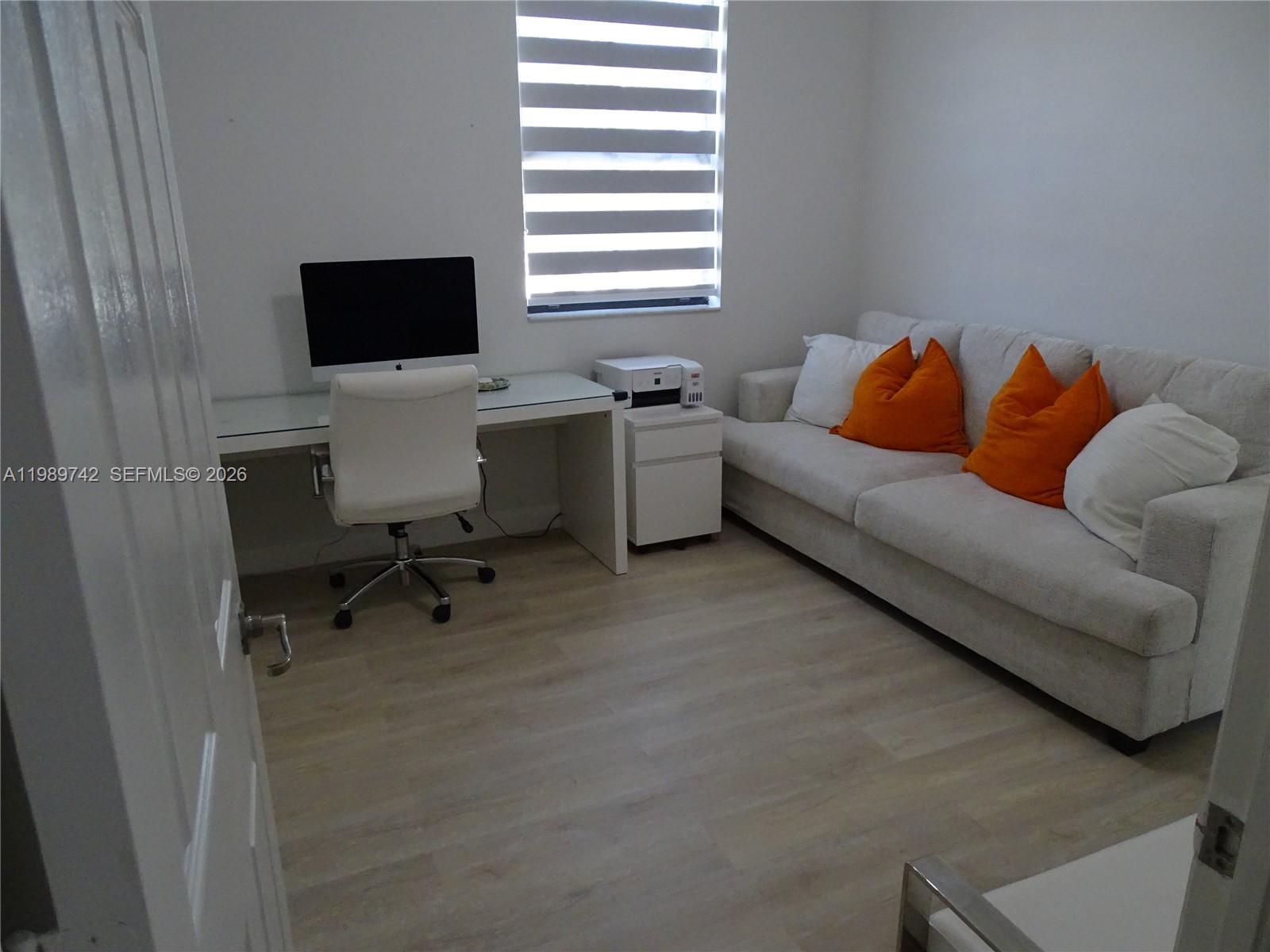 24164 Southwest 113th Path Homestead, FL 33032 - Photo 23 of 68 a living room with furniture and a flat screen tv