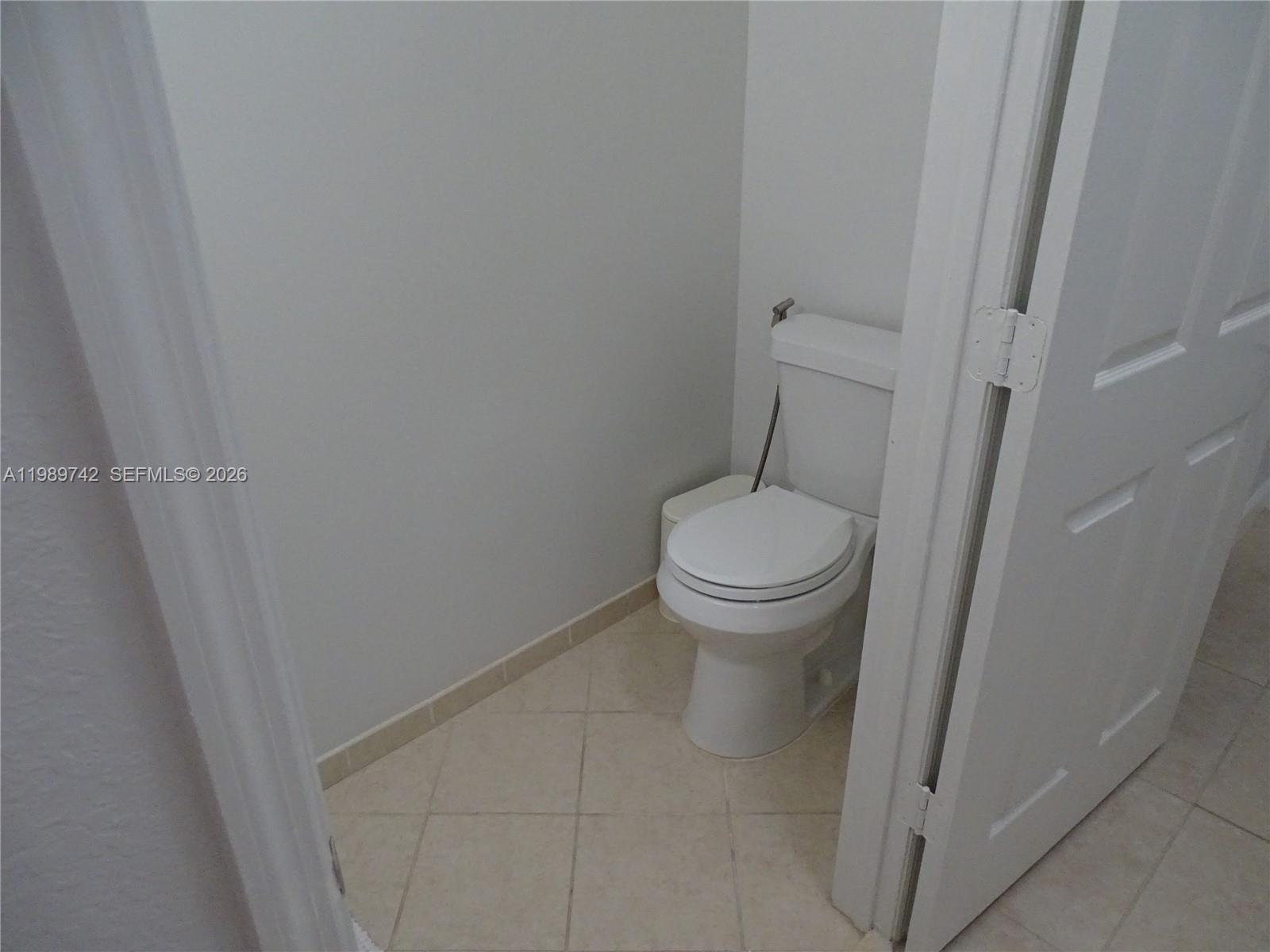 24164 Southwest 113th Path Homestead, FL 33032 - Photo 35 of 68 a white toilet sitting next to a shower