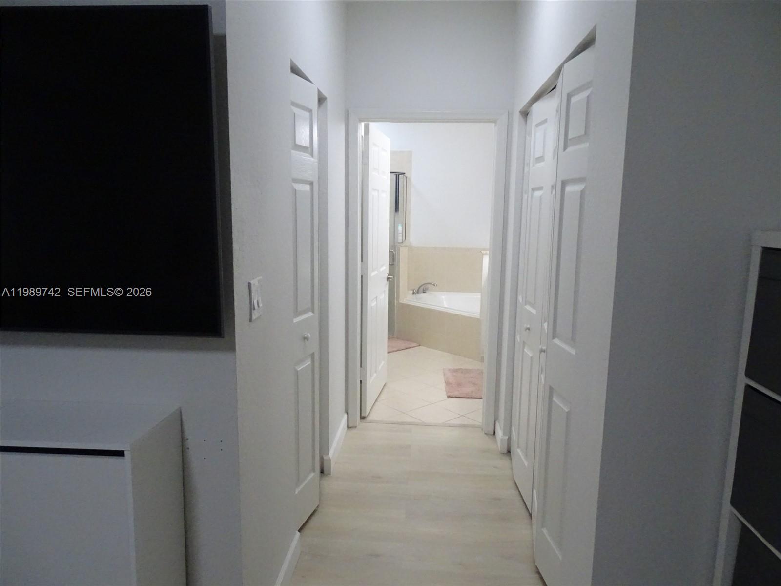 24164 Southwest 113th Path Homestead, FL 33032 - Photo 45 of 68 a view of a bathroom from a hallway