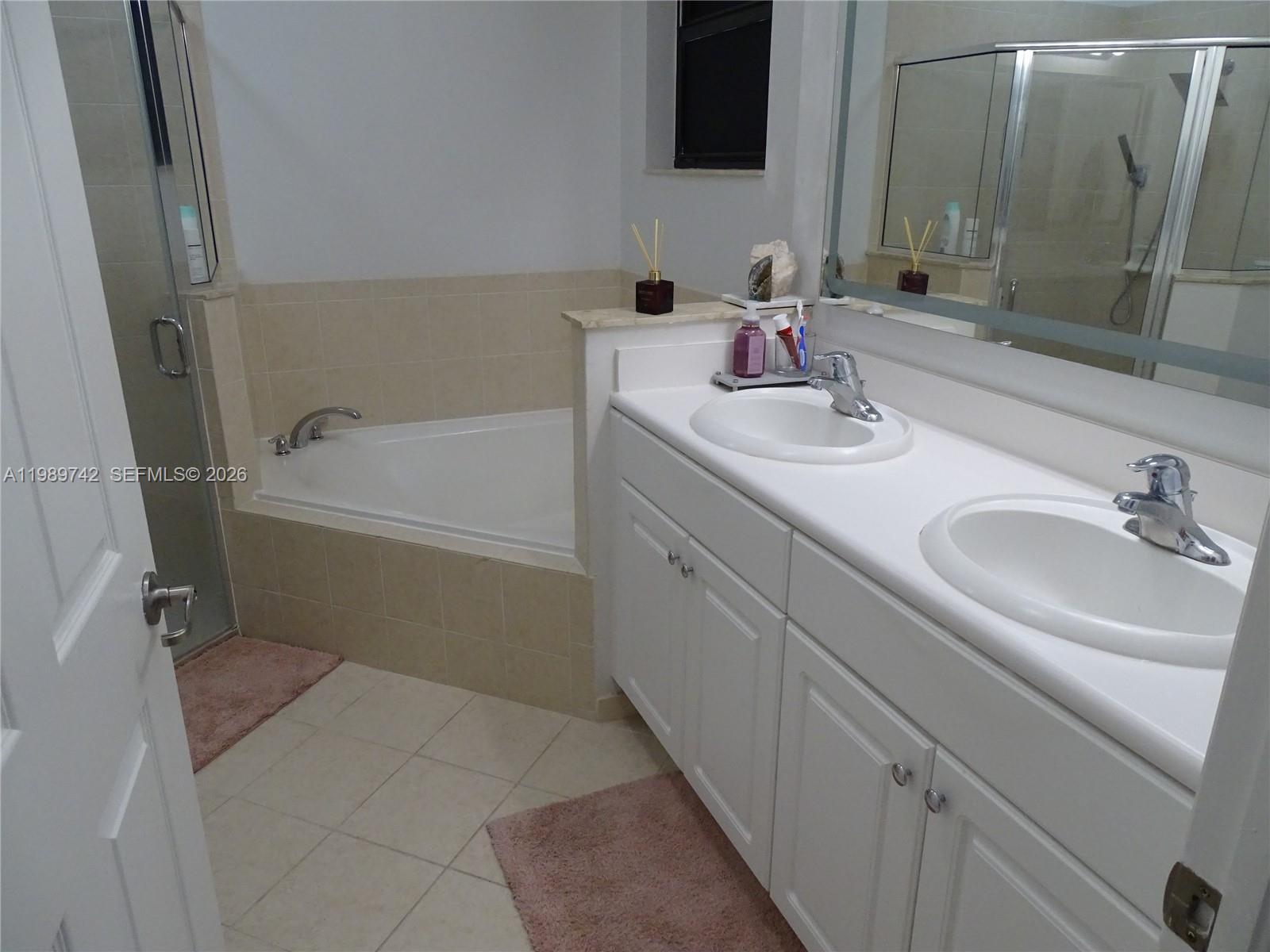 24164 Southwest 113th Path Homestead, FL 33032 - Photo 46 of 68 a bathroom with a sink and a mirror