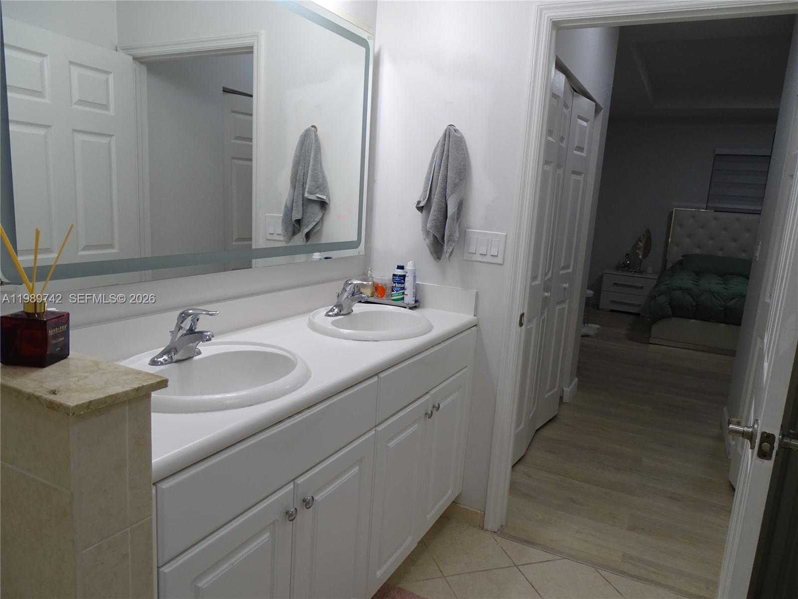 24164 Southwest 113th Path Homestead, FL 33032 - Photo 51 of 68 a bathroom with a sink and a mirror