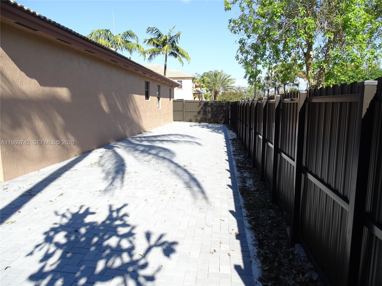 24164 Southwest 113th Path Homestead, FL 33032 - Photo 60 of 68 a view of a backyard of the house
