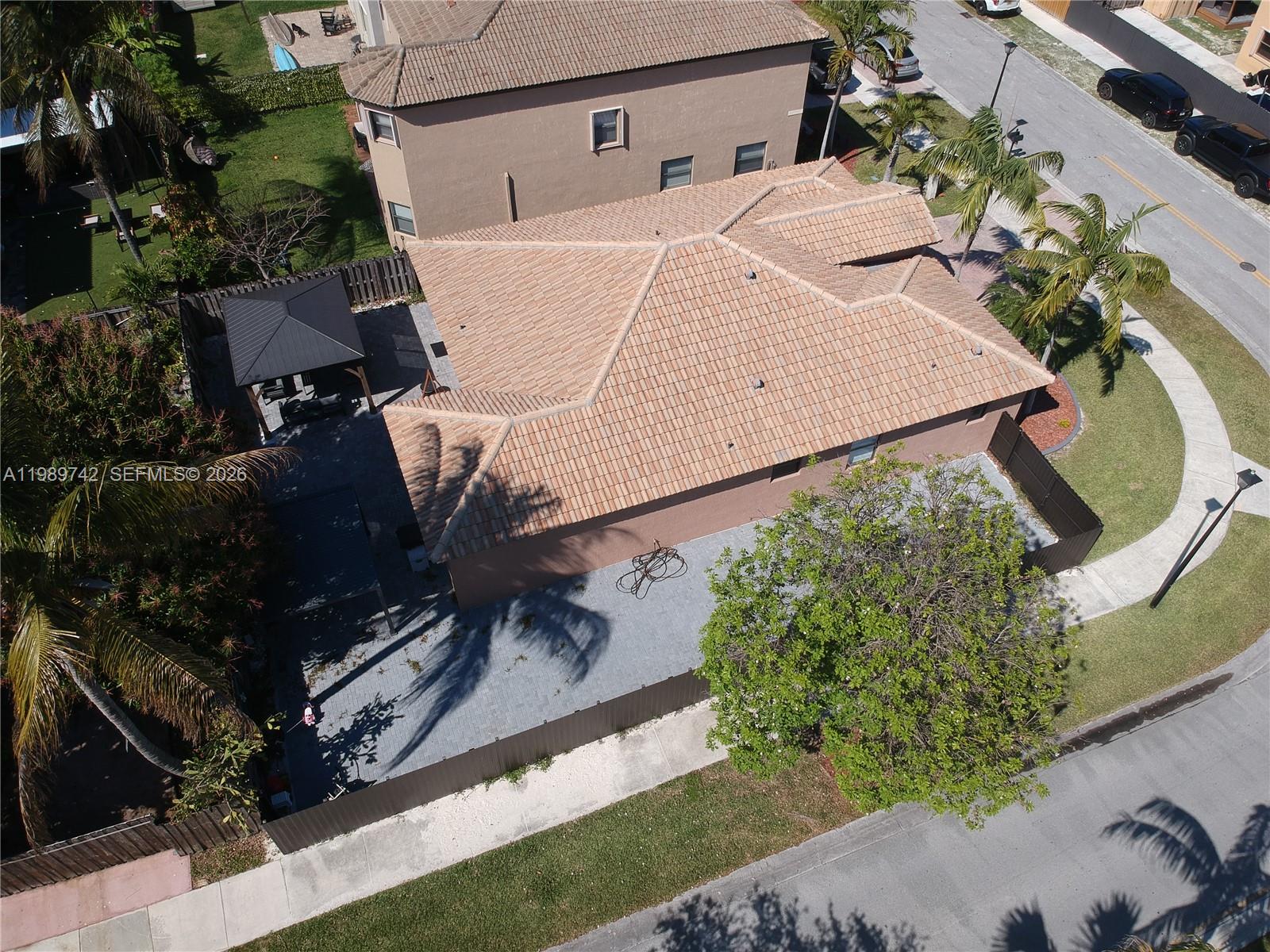 24164 Southwest 113th Path Homestead, FL 33032 - Photo 7 of 68 aerial view of a house with a yard and potted plants