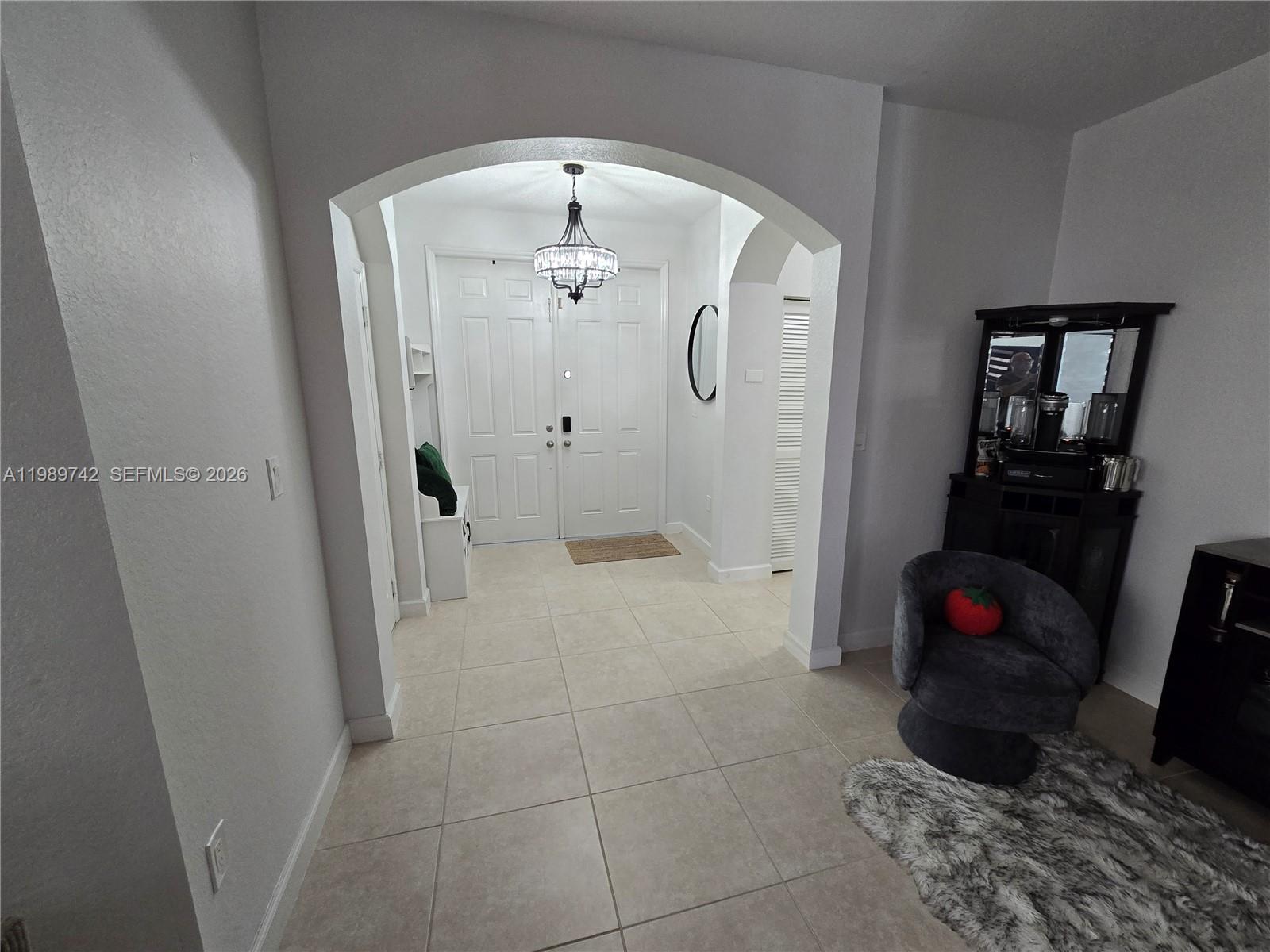 24164 Southwest 113th Path Homestead, FL 33032 - Photo 10 of 68 a bathroom with a tub shower and mirror