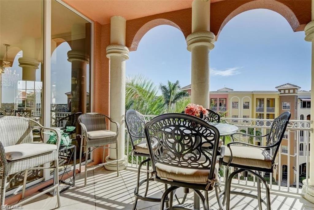 450 Bayfront Place, Unit 4502 Naples, FL 34102 - Photo 3 of 11 a view of a dinning table and chairs in patio