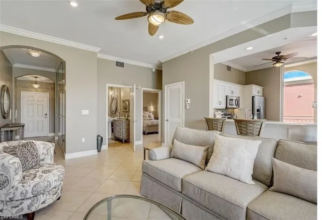 a living room with furniture and a large mirror