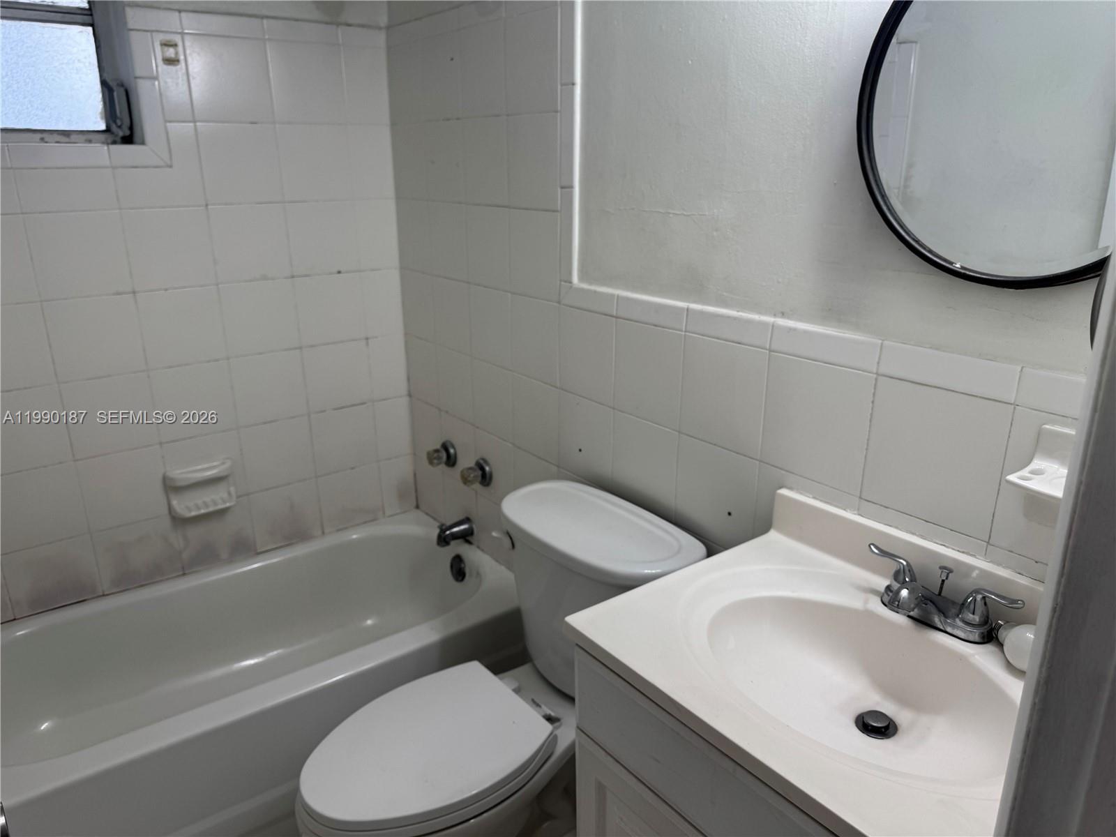 11 Southwest 32nd Avenue, Unit 4 Miami, FL 33135 - Photo 13 of 13 a bathroom with a sink toilet and a bathtub