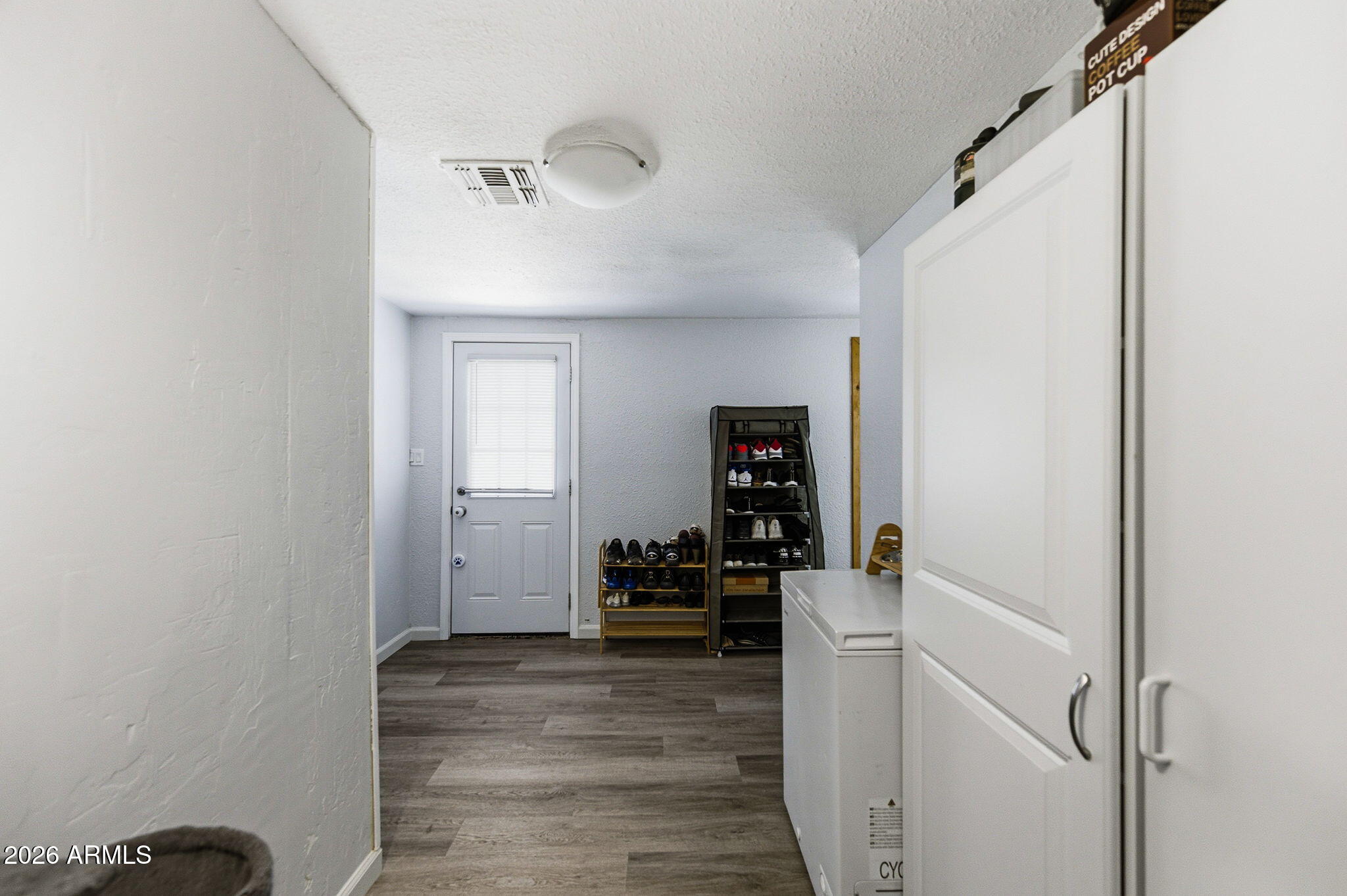 1268 East Rodeo Road Casa Grande, AZ 85122 - Photo 19 of 27 a room with a closet and wooden floor