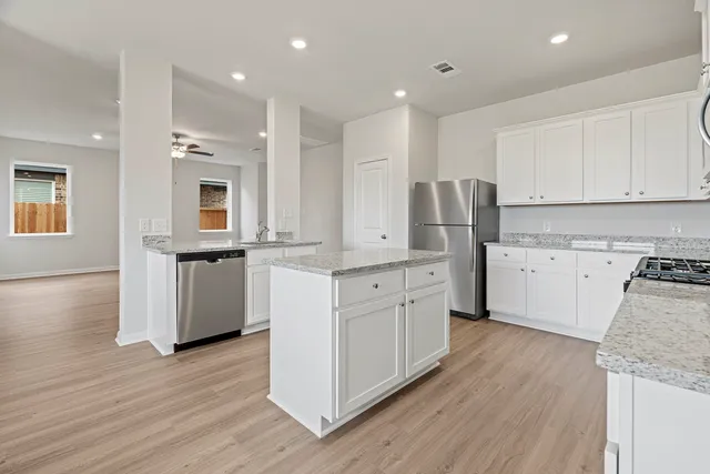 a view of an empty room and closet area