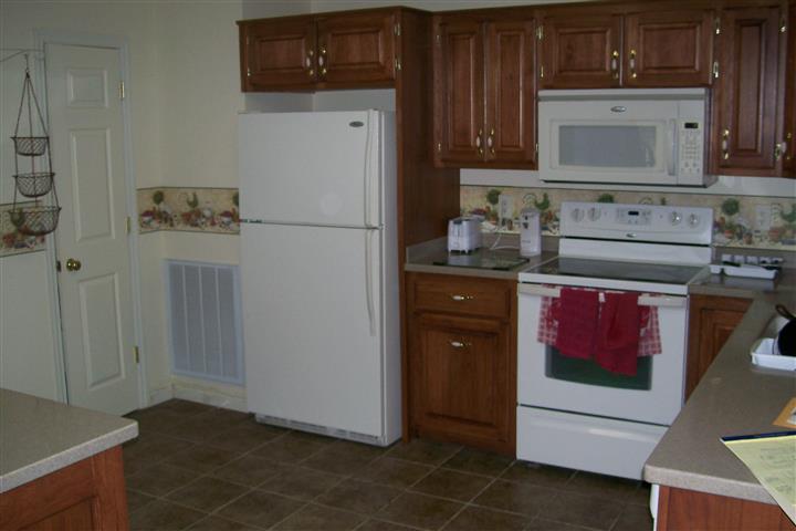 10748 Harrison Ferry Road McMinnville, TN 37110 - Photo 16 of 29 a kitchen with stainless steel appliances granite countertop a refrigerator stove and sink