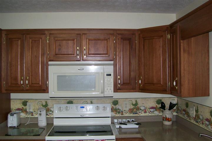 10748 Harrison Ferry Road McMinnville, TN 37110 - Photo 17 of 29 a stove top oven sitting inside of a kitchen
