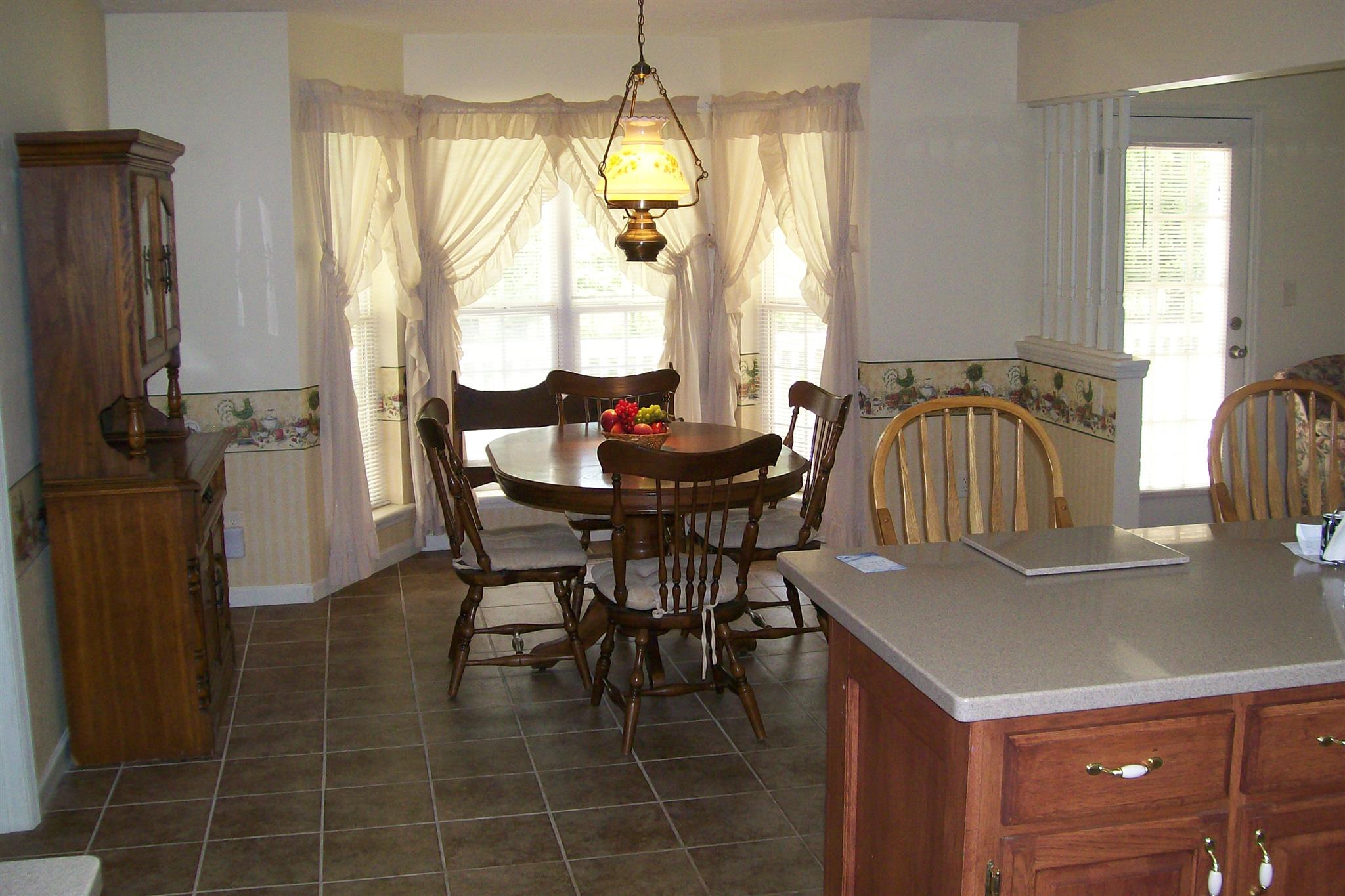 10748 Harrison Ferry Road McMinnville, TN 37110 - Photo 18 of 29 a dining room with furniture and window