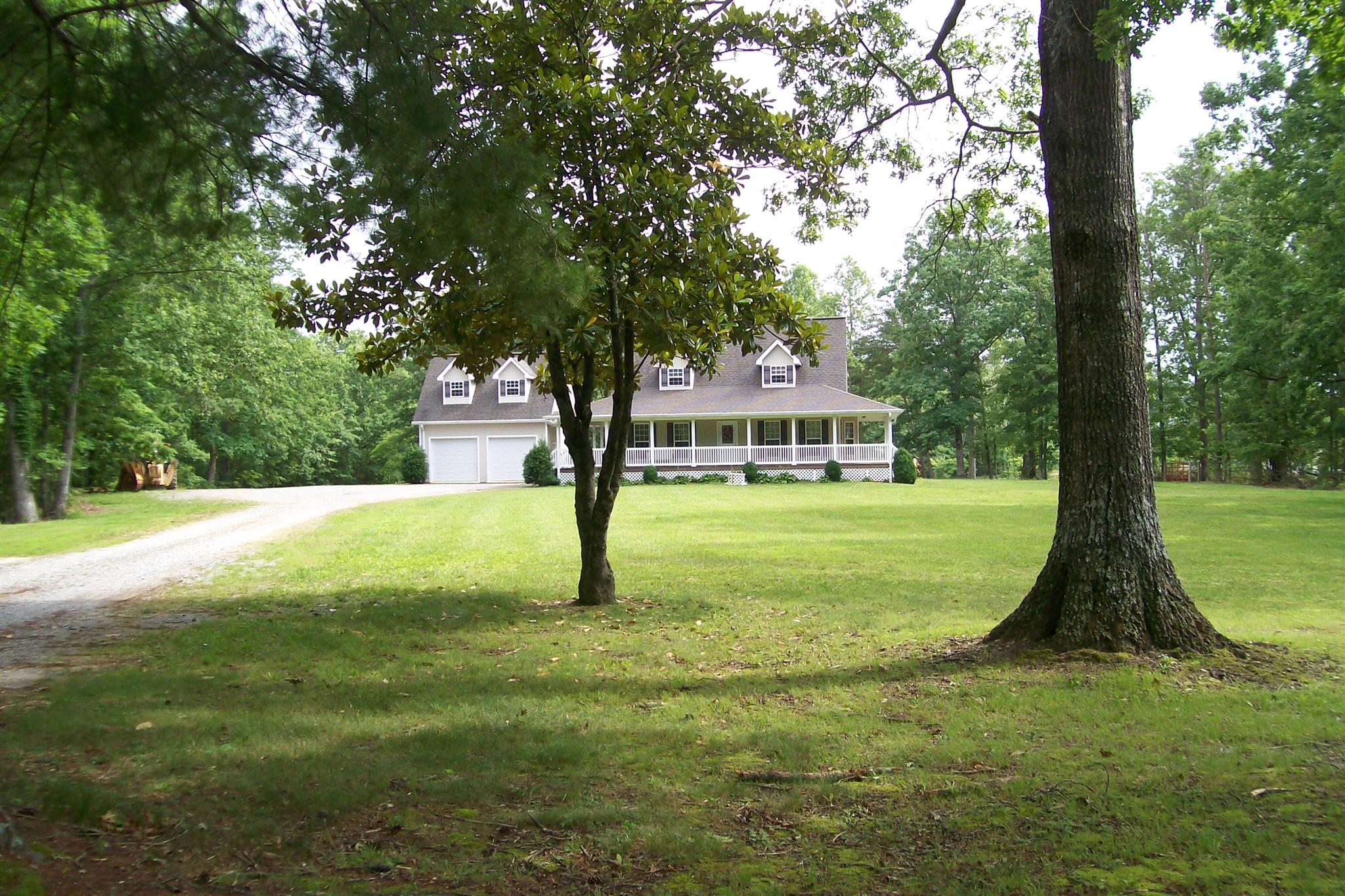 10748 Harrison Ferry Road McMinnville, TN 37110 - Photo 3 of 29 a view of a house with a tree in a yard