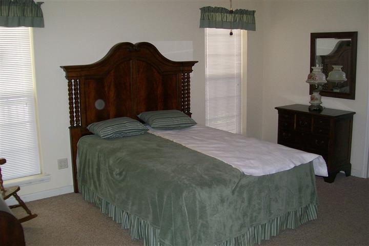 10748 Harrison Ferry Road McMinnville, TN 37110 - Photo 24 of 29 a bedroom with a bed and a mirror on dresser