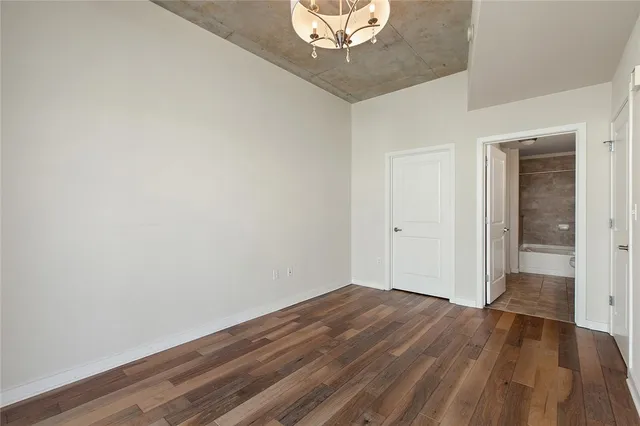 a view of a room with wooden floor