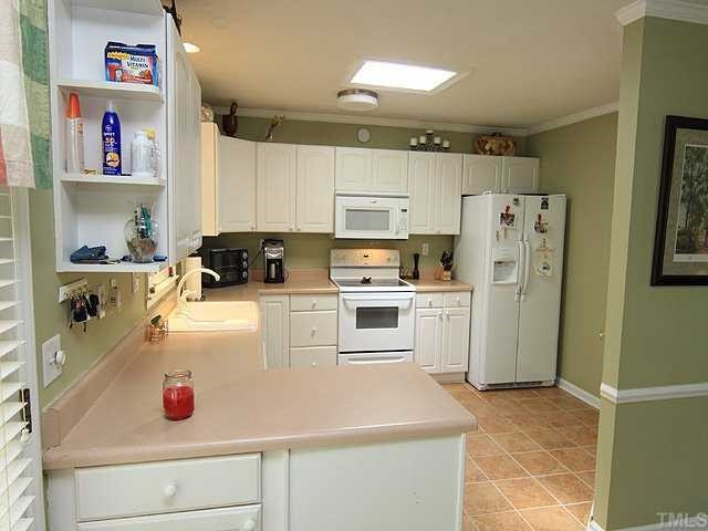 5312 McCormick Road Durham, NC 27713 - Photo 5 of 12 Very Bright Kitchen with window & Skylight, lost of Counter and Cabinet space, with a nice Pantry and custom Tile Floor Kitchen