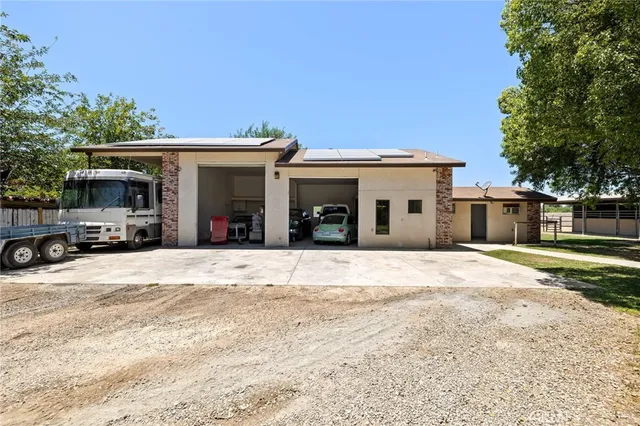 a view of a tree in front of a house