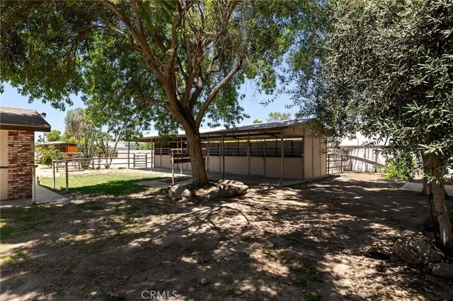 a view of pool and trees in the background
