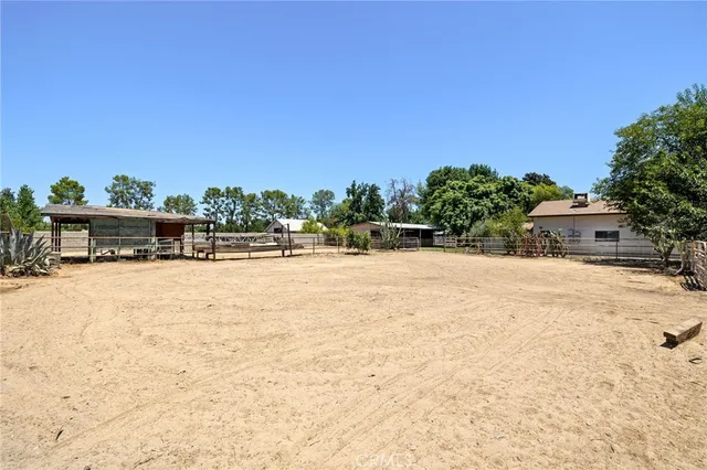 an aerial view of a house with outdoor space