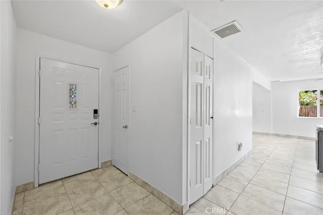a kitchen with stainless steel appliances kitchen island granite countertop a sink and a stove