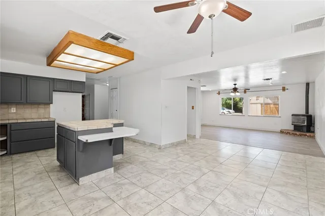 a utility room with a sink a vanity and window