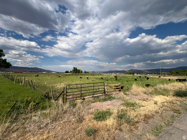 950 West Old Airport Road Monroe, UT 84754 - Photo 1 of 5 Expansive open field with green pasture and distant mountain ranges