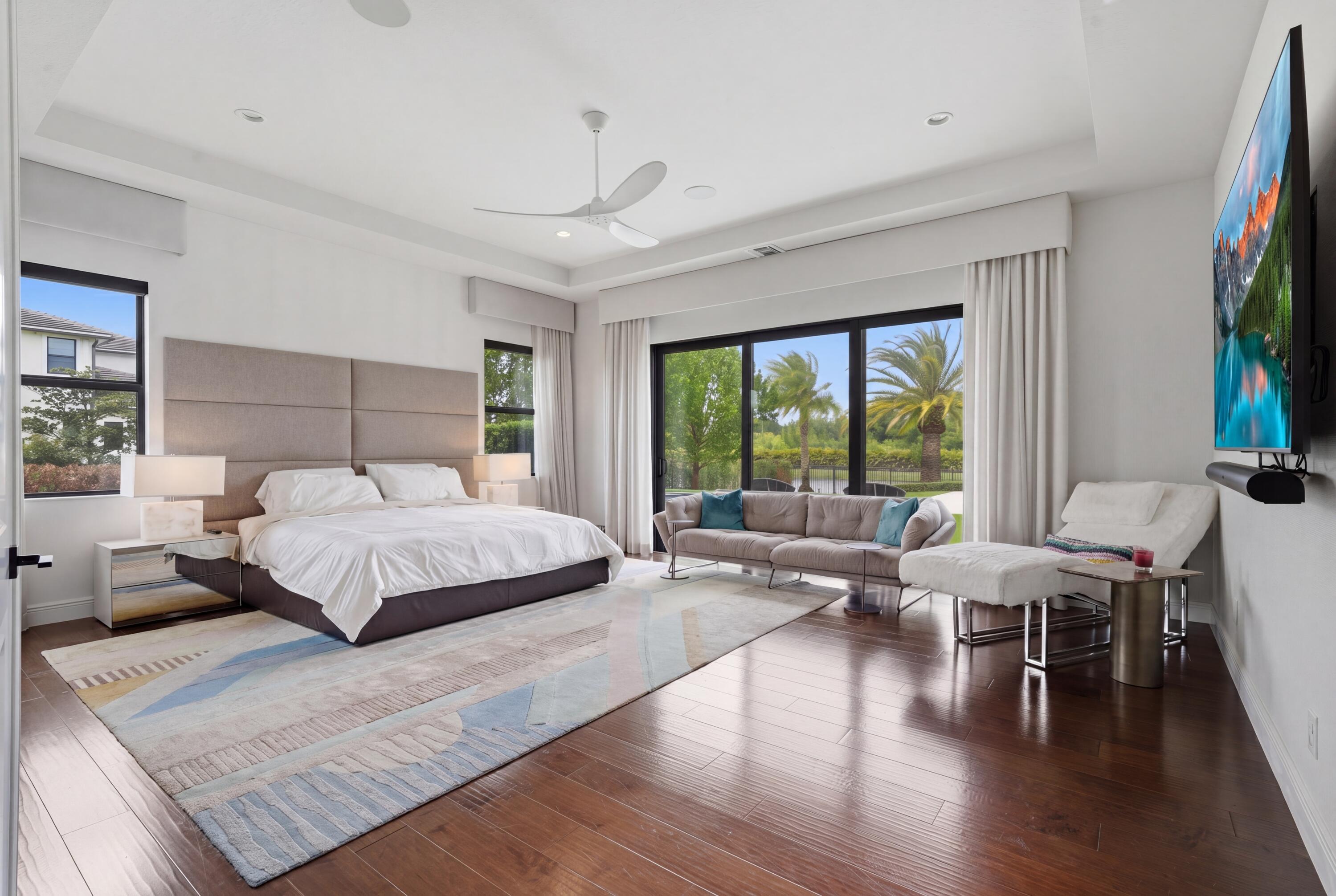 17101 Magnolia Estates Drive Southwest Ranches, FL 33331 - Photo 20 of 57 a bedroom with a large bed and a large window