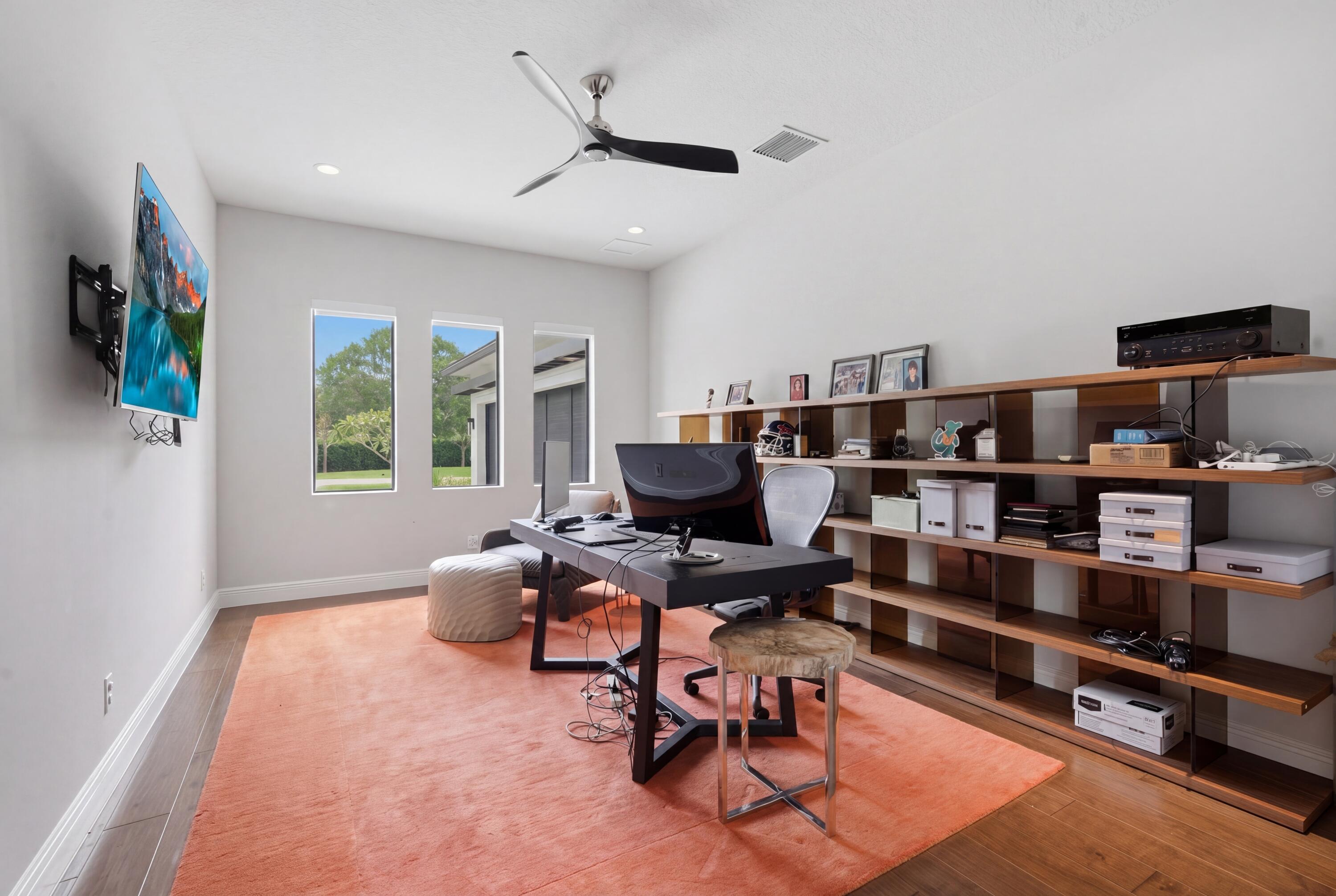 17101 Magnolia Estates Drive Southwest Ranches, FL 33331 - Photo 25 of 57 a work room with furniture and a book shelf