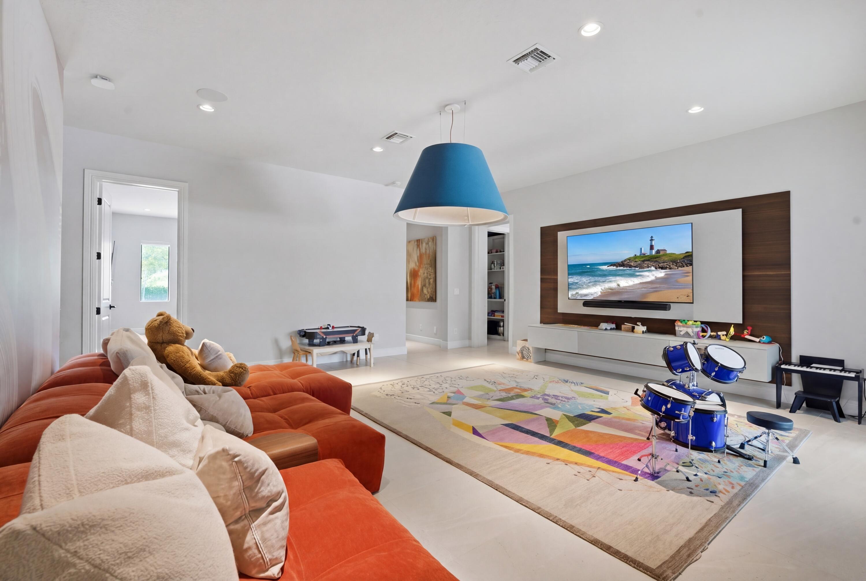 17101 Magnolia Estates Drive Southwest Ranches, FL 33331 - Photo 29 of 57 a living room with furniture and a flat screen tv