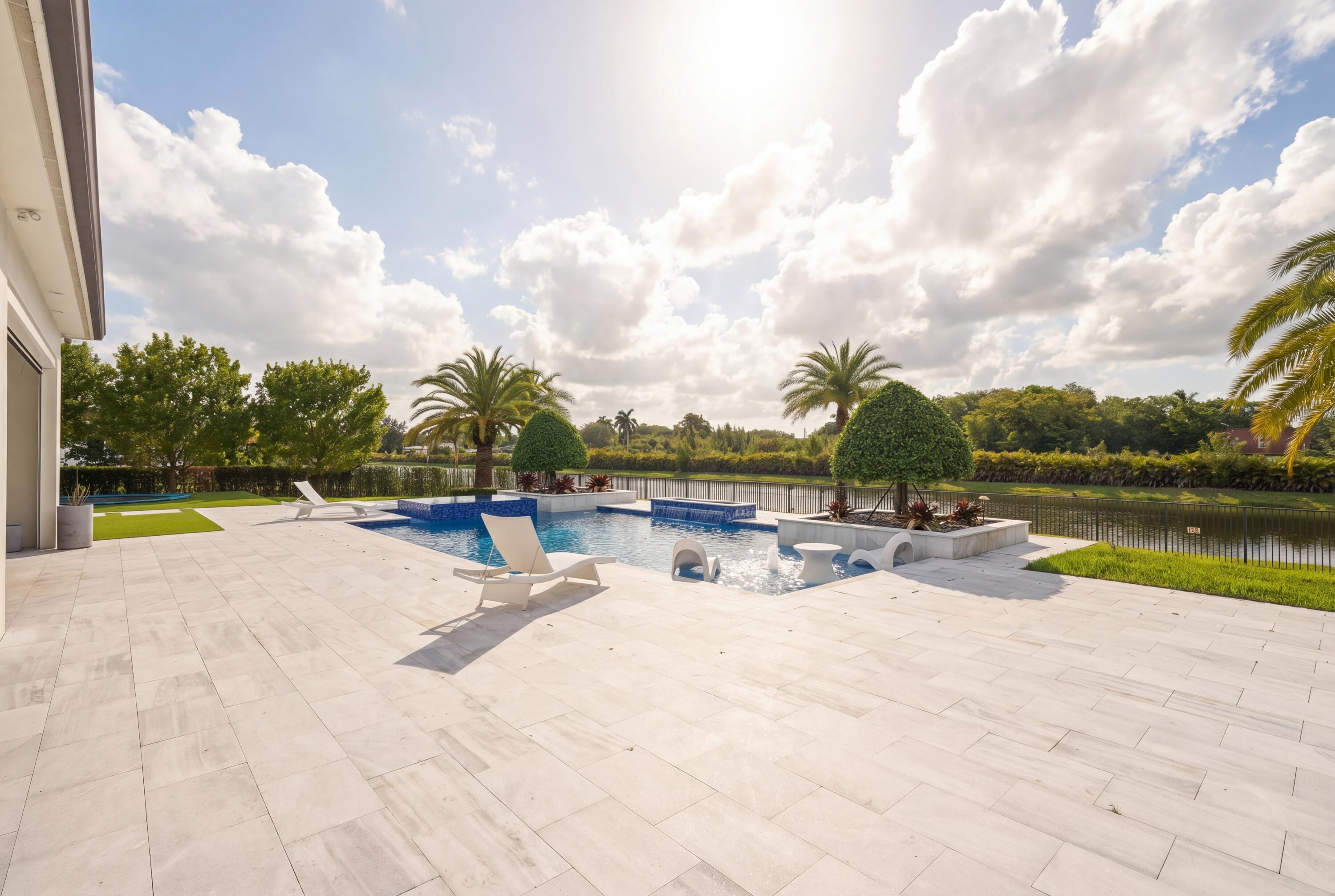 17101 Magnolia Estates Drive Southwest Ranches, FL 33331 - Photo 43 of 57 a view of swimming pool with outdoor seating and yard in back