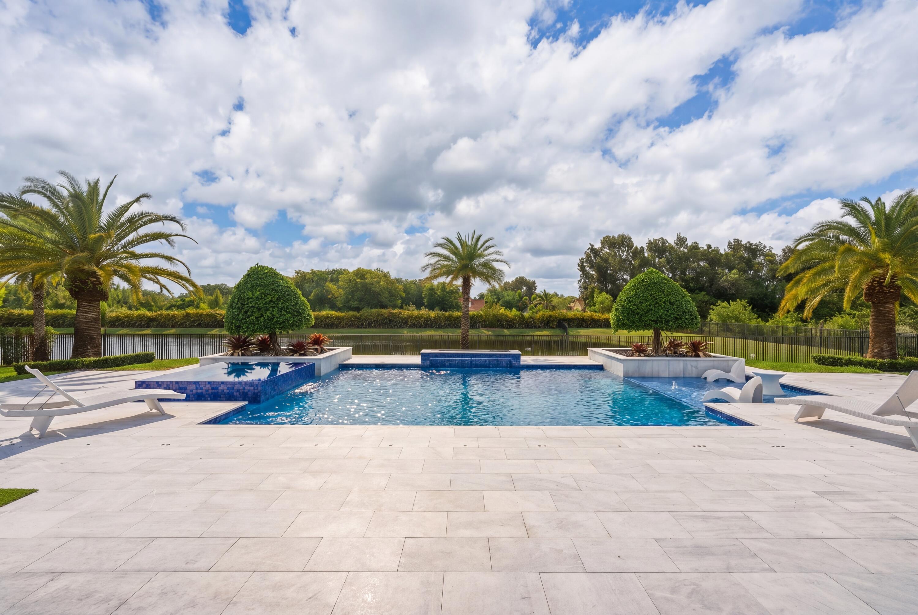 17101 Magnolia Estates Drive Southwest Ranches, FL 33331 - Photo 45 of 57 a view of a swimming pool with lounge chairs