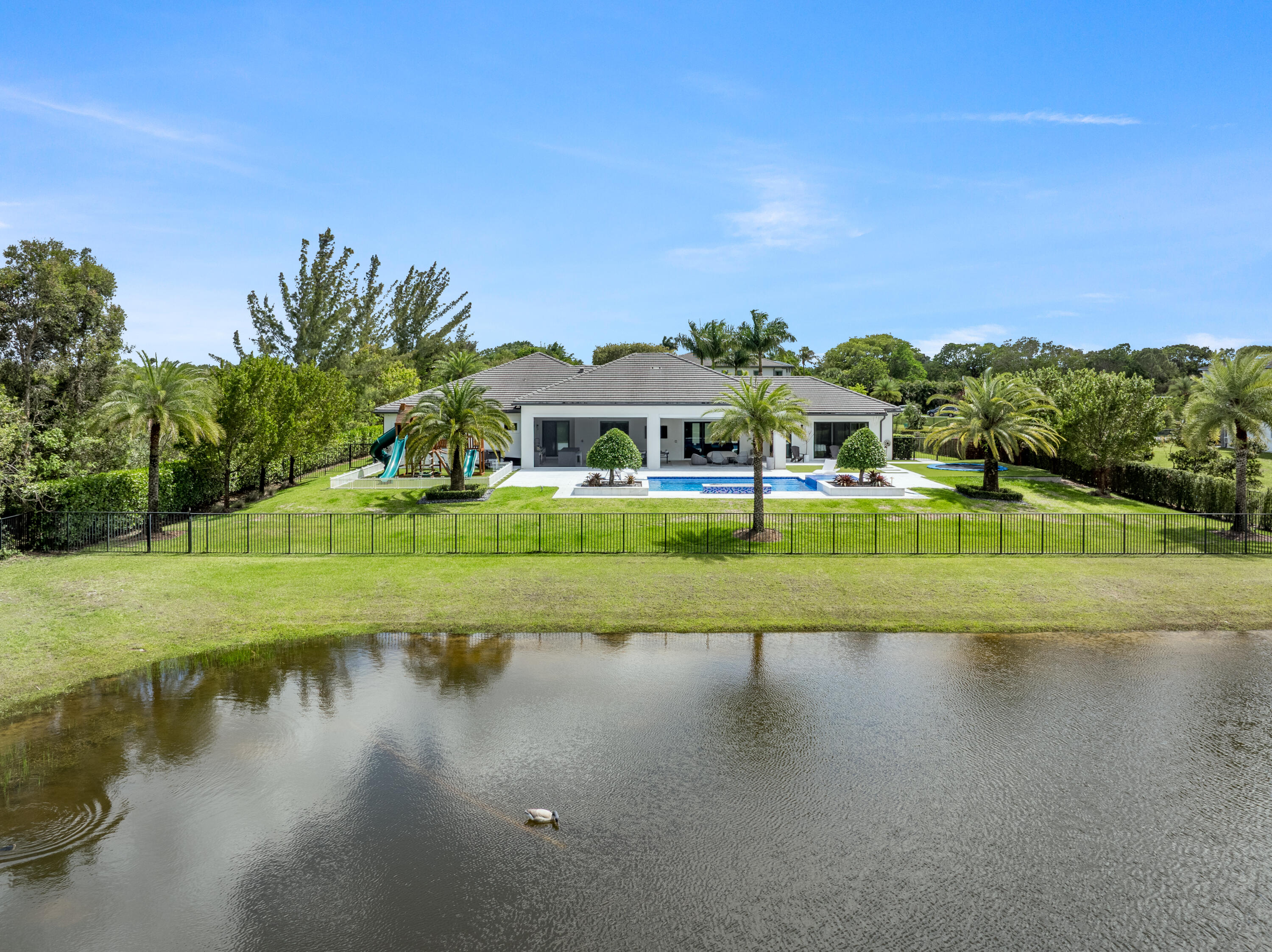 17101 Magnolia Estates Drive Southwest Ranches, FL 33331 - Photo 53 of 57 a view of residential houses with outdoor space and lake view