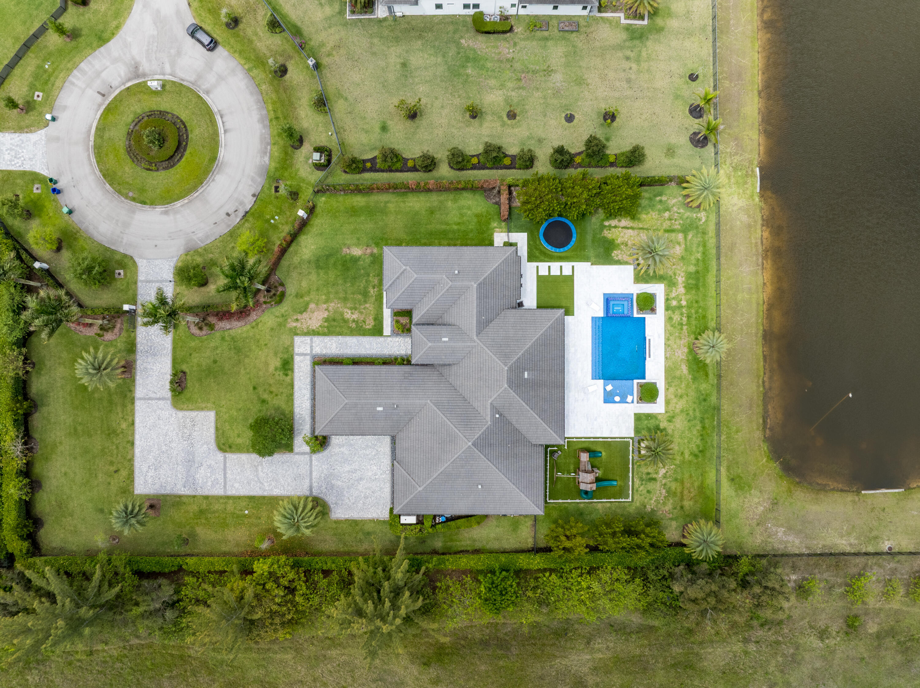 17101 Magnolia Estates Drive Southwest Ranches, FL 33331 - Photo 56 of 57 an aerial view of a house with a swimming pool