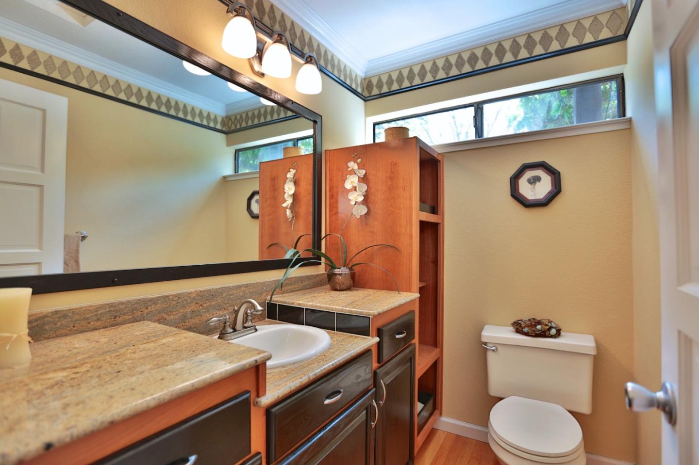 9040 El Matador Drive Gilroy, CA 95020 - Photo 13 of 26 a bathroom with a granite countertop sink and a mirror