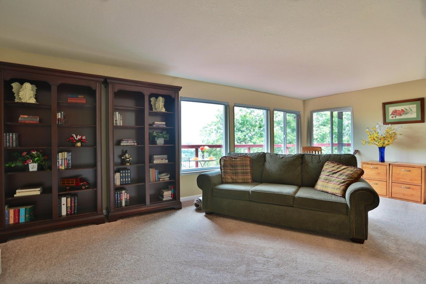 9040 El Matador Drive Gilroy, CA 95020 - Photo 14 of 26 a living room with furniture and a floor to ceiling window