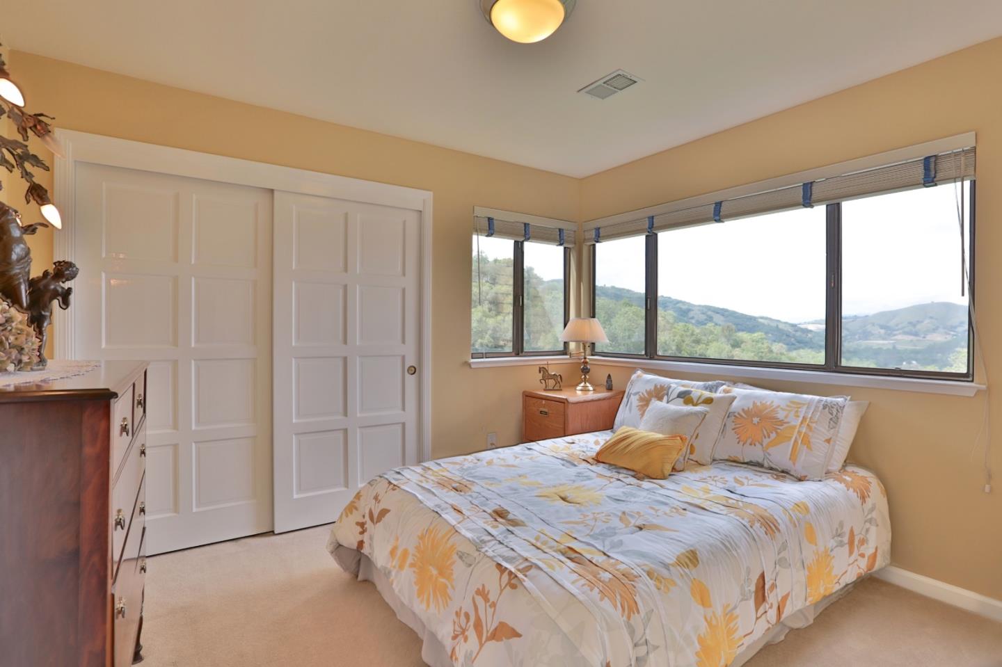 9040 El Matador Drive Gilroy, CA 95020 - Photo 16 of 26 a bedroom with a large bed and a window