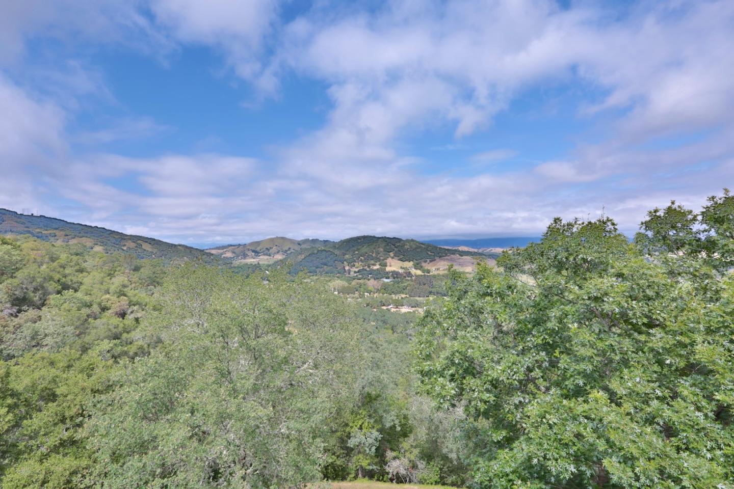 9040 El Matador Drive Gilroy, CA 95020 - Photo 24 of 26 a view of a green field with a mountain in the background