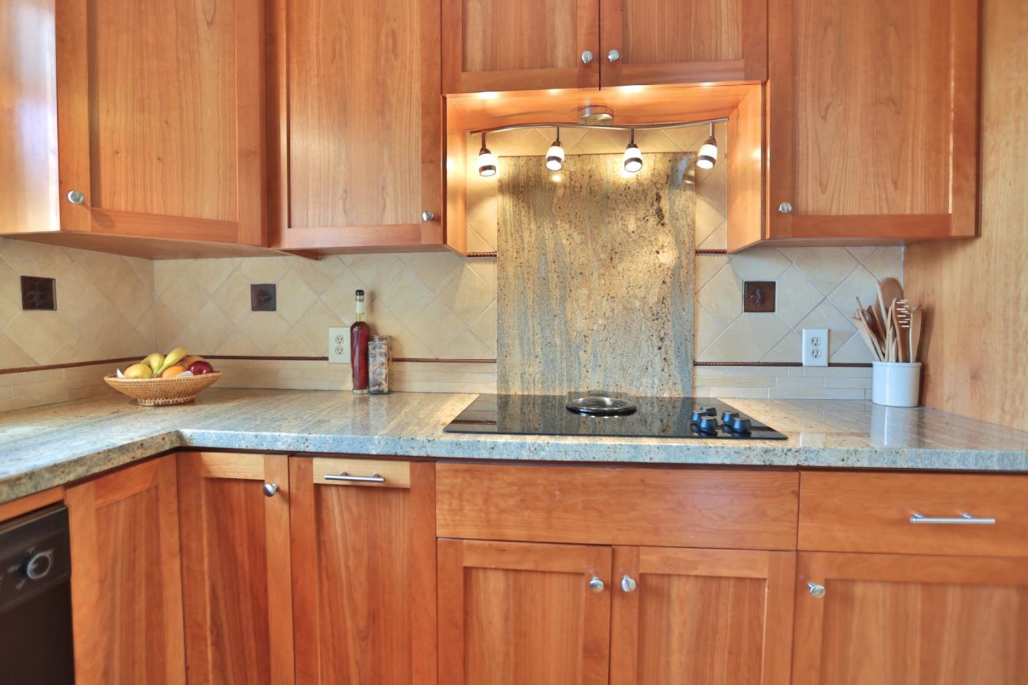 9040 El Matador Drive Gilroy, CA 95020 - Photo 6 of 26 a kitchen with granite countertop stainless steel appliances a sink and cabinets