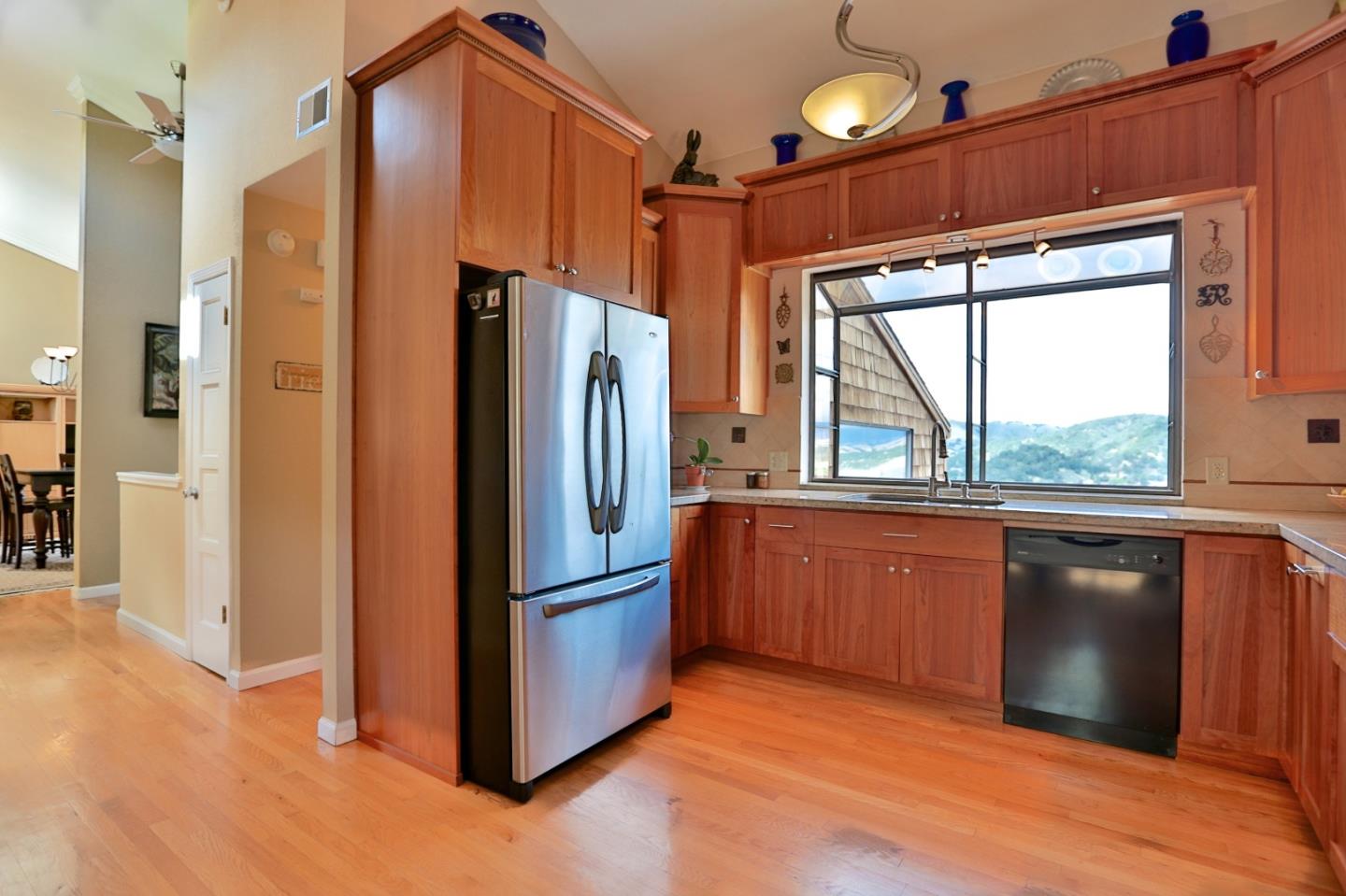 9040 El Matador Drive Gilroy, CA 95020 - Photo 7 of 26 a kitchen with stainless steel appliances granite countertop a refrigerator and a sink