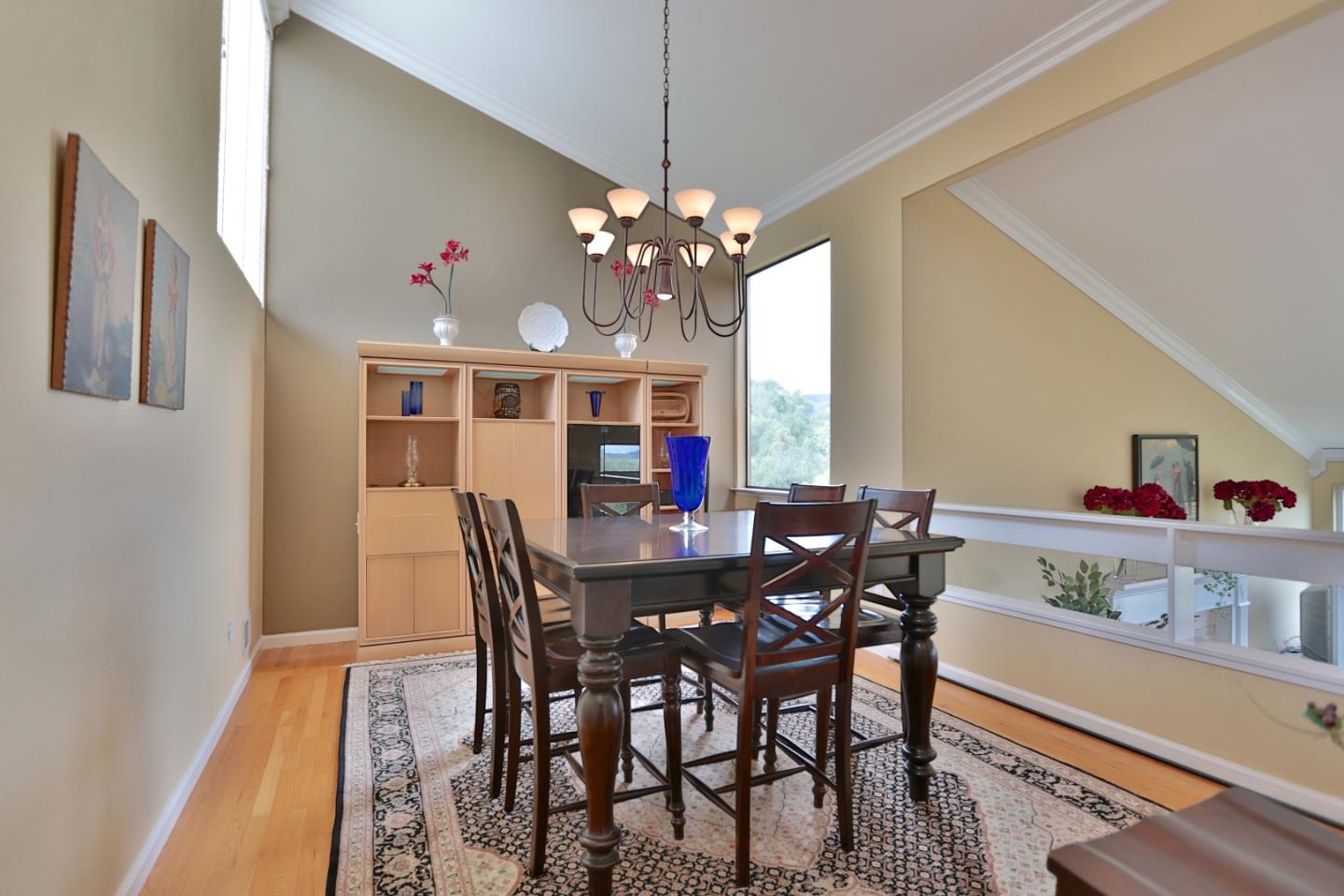 9040 El Matador Drive Gilroy, CA 95020 - Photo 8 of 26 a view of a dining room with furniture and a chandelier