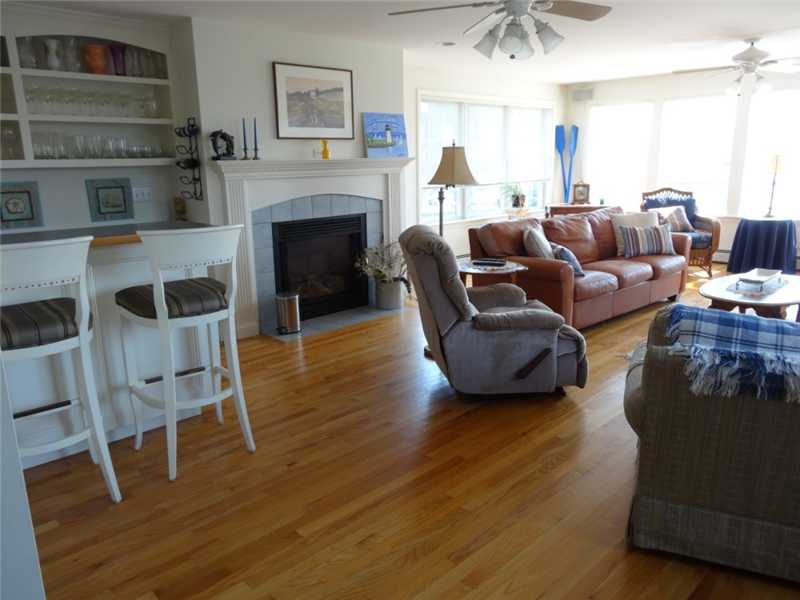 16 Abalone Road Narragansett, RI 02882 - Photo 4 of 18 Den/Family/Great Room. family/great room, gas fireplace, lavette, gorgeous hardwood floors, windows galore to enjoy the views