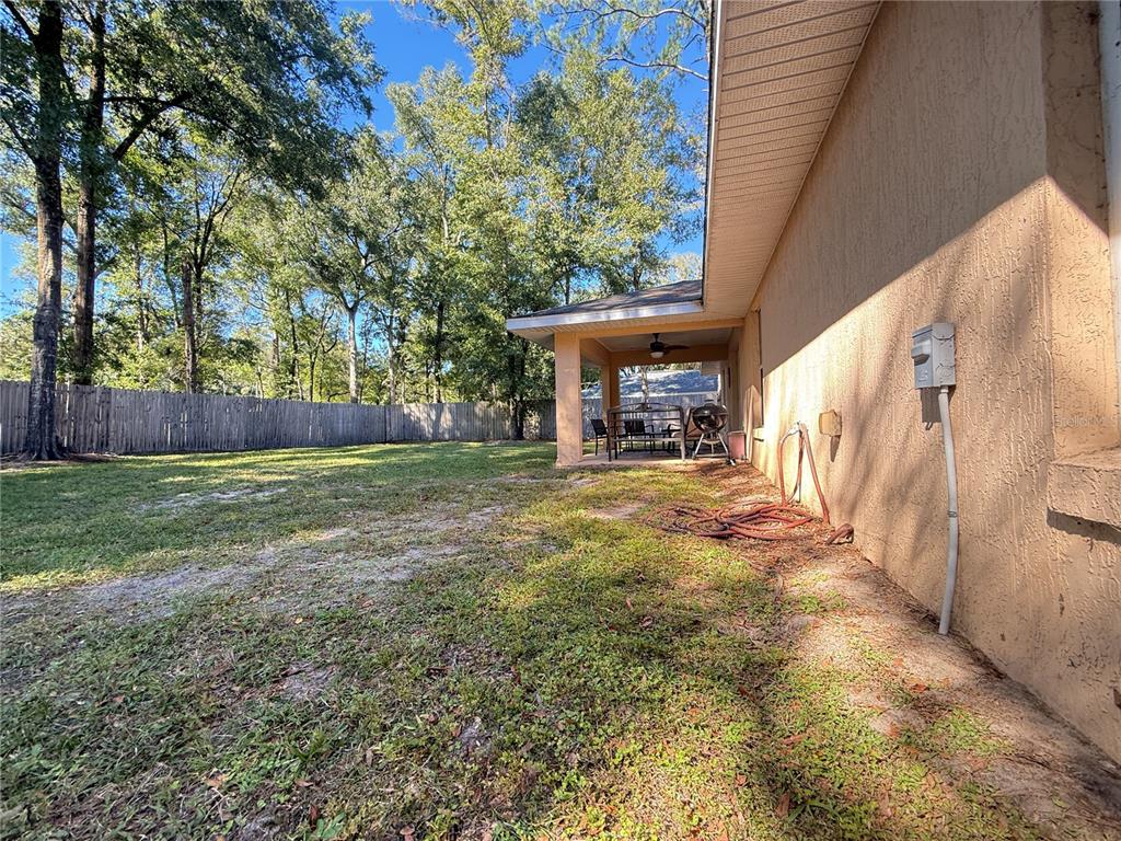 6470 Northwest 56th Terrace Ocala, FL 34482 - Photo 32 of 34 a view of patio with yard