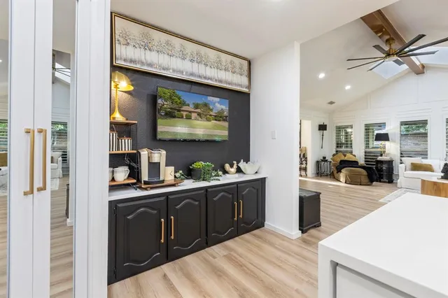 a kitchen with stainless steel appliances kitchen island granite countertop a refrigerator and a stove top oven