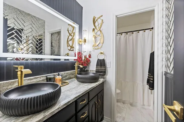 a kitchen with a sink and a refrigerator