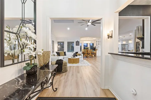 a view of a living room and bathroom