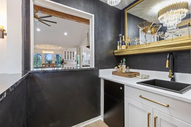 a view of a bathroom with a sink and mirror