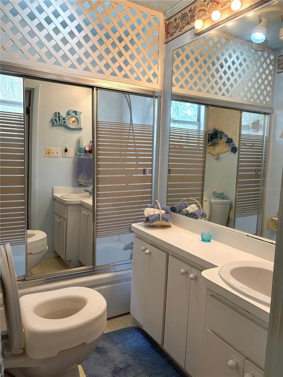 21249 Durden Road Dade City, FL 33523 - Photo 7 of 28 a bathroom with a sink a toilet and shower